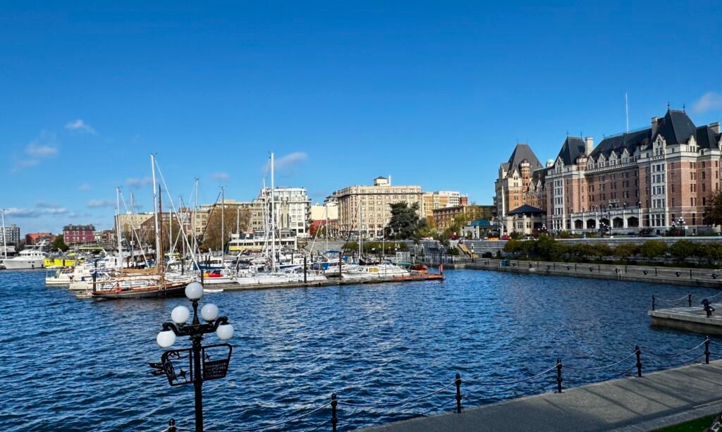 Horizontal Format: Harbor with boats and buildings.