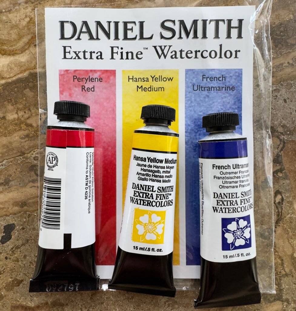yellow red blue watercolor paint tubes